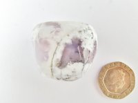 Merlinite: polished pebble