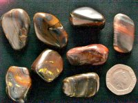 (image for) Tiger Iron: tumbled stones